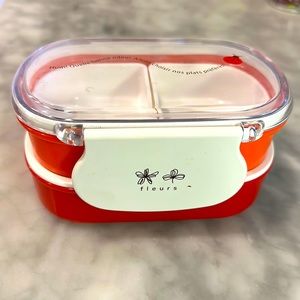Cute red bento box with ladybug and flower motif